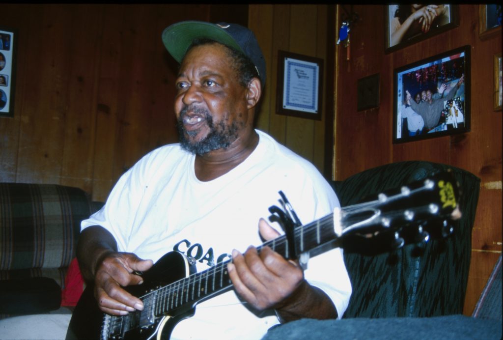 Wakefield “Big Moody” Coney of McComb performs in his family room for friends.