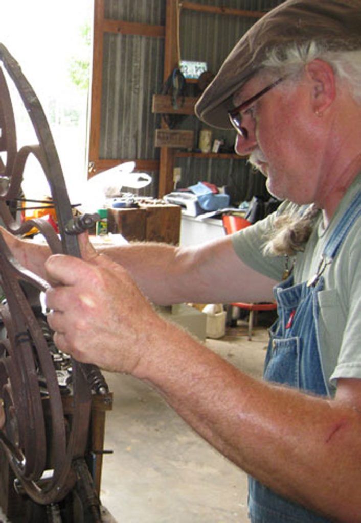 Metal worker Larry House at his home studio in Picayune.