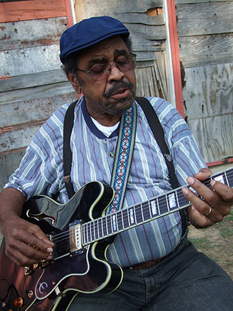 Close-up of Williams playing guitar (photo by Scott Baretta for the Mississippi Arts Commission).