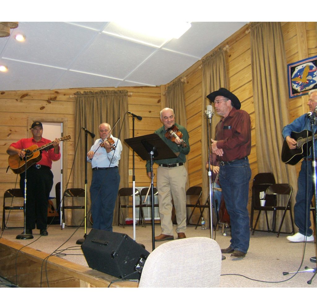 Musicians performing at the weekly jam session at Wayne Wilson Trucking in Bellevue, Mississippi (photo by Chris Goertzen for the Mississippi Arts Commission).