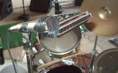 Hezekiah Early’s harmonica, taped to microphone, microphone stand.