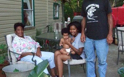 Cage on his deck with his wife Minnie, great-grandson Dustin, and granddaughter Cierra Sherman (not mother of Dustin). Cierra is a graduate student at Jackson State University, studying English.