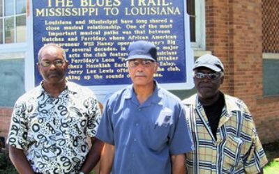 From left, Hezekiah Early, YZ Ealey and Little Poochie, unveiling of MS Blues Trail marker, in front of the Delta Music Museum. Both Early and Ealey appear on both sides of the marker, recognizing their performances at Haney’s Big House.