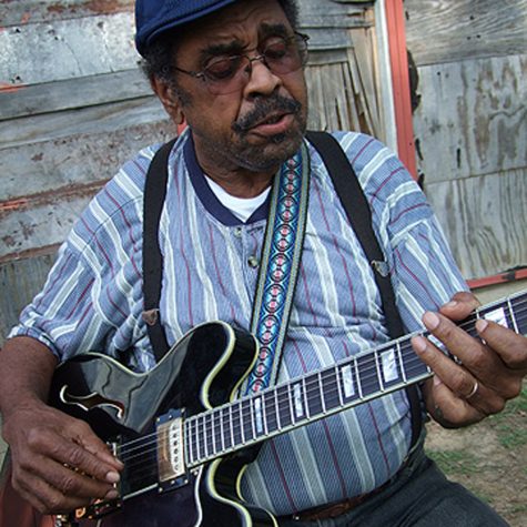 Close-up of Williams playing guitar (photo by Scott Baretta for the Mississippi Arts Commission).