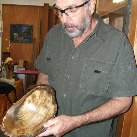 Terry Tjader and bowl with natural edges from popcorn tree, or Chinese tallow (photo by Chris Goertzen for the Mississippi Arts Commission).