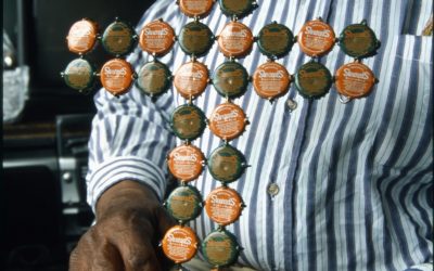 Close-up of a bottle cap cross made by Chism.