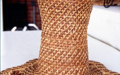Pine straw vase with walnut slice decorations.