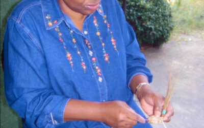 Bessie Johnson of West Point begins work on a pine straw tray.